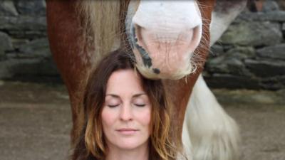 Katherine Beaumont meditates with a horse