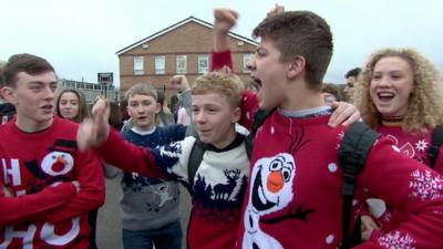 School children wearing Christmas jumpers