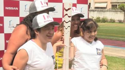 Brazilian kids get up close with the Paralympic torch