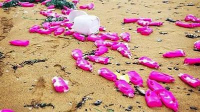 Pink bottles wash up on Cornish coast