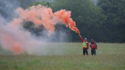Rescuers with a flare