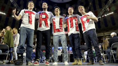 Trump supporters wear T-shirts with his name on at a rally in Lynchburg, Virginia
