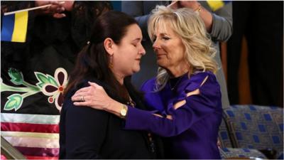 Lady Jill Biden hugs Ukrainian ambassador.