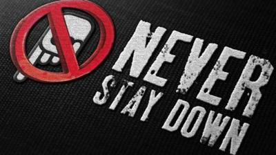 'Never Stay Down' logo