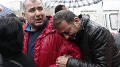 Grieving men in Ankara