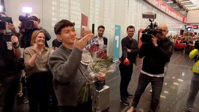 Austria's newest Eurovision winner JJ receives a hero's welcome as he lands home in Vienna