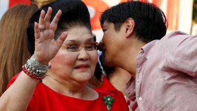 Philippines Vice-Presidential candidate BongBong Marcos whispers to his mother, former First Lady and Congresswoman Imelda Marcos