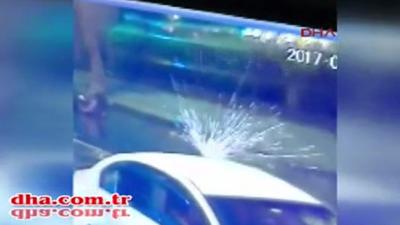 Bullets hit passing car roof