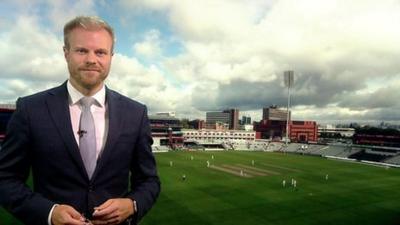 Simon King in front of an overcast cricket pitch