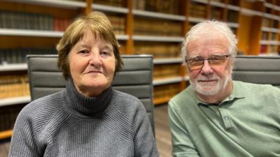 Picture of Pauline Murrell and Roger Parrish in a room at the courthouse in Paris