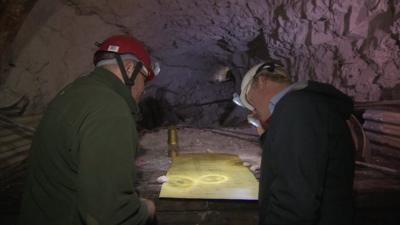 John Maguire and National Trust volunteer Gordon Wise look at original MOD plans for WW2 tunnels under Dover