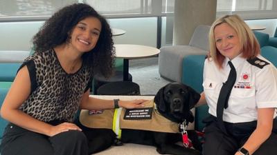 Nina Blissett with Reqs the fire investigation dog and Nikki their handler