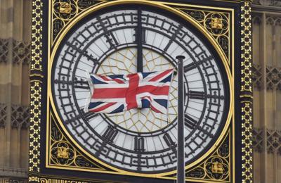 A British Union flag flutters in front of Big Ben