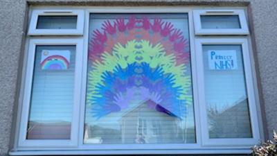 RAINBOW-IN-WINDOW-PAPER-HANDS.
