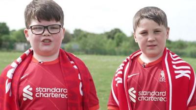 Boys in football kit.