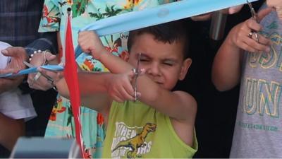 Boy steals limelight after cutting ribbon too soon