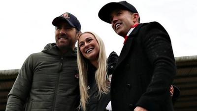 Rhiannon Roberts (centre) Ryan Reynolds and Rob McElhenney at The Racecourse