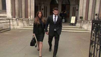 Ched Evans (R) leaving court this