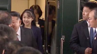 Kim Jong Un stepping out of train followed by his daughter Kim Ju Ae