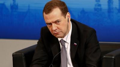 Russian Prime Minister Dmitry Medvedev waits on the podium at the Security Conference in Munich, Germany