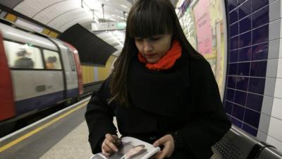 Liz Atkin drawing on tube platform