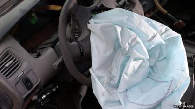 File photo: Close up of Takata airbag deployed in an old Honda Accord at a salvage yard in Florida