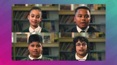 four-children-sit-in-front-of-books