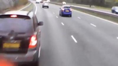 A lorry crashes into a broken down car