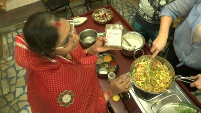 Rekha Sharma teaching her cookery classes