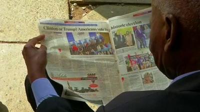 Man reads a newspaper in Nairobi, Kenya