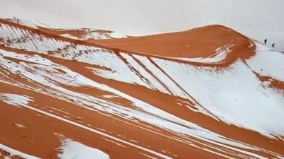 Snow is seen on the sand dunes of the Sahara