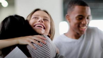 Students hug after getting exams results