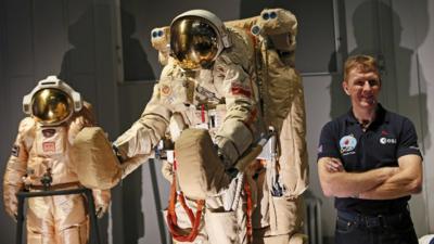 Tim Peake next to astronauts