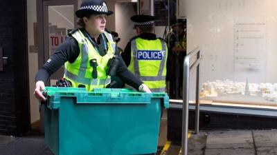 Police officer with box