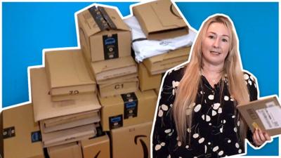 Zoe Kleinman stood next to a pile of package