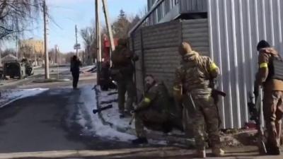 Ukrainian fighters launch rocket propelled grenades at Russian forces