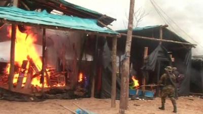 Authorities destroying a mining camp