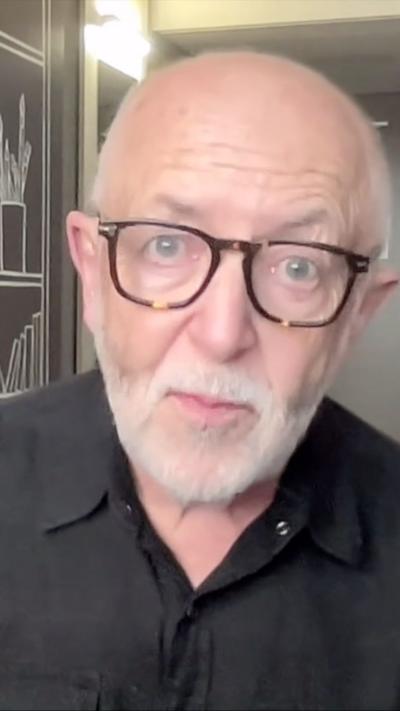 BBC International editor Jeremy Bowen wearing black shirt 