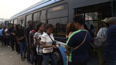 People boarding a bus in Lagos