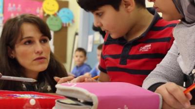 Amer, a 10-year-old Syrian, is learning German in Oberhausen's integration school