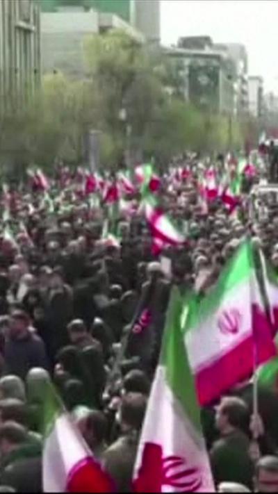 Large crowd with Iranian flags