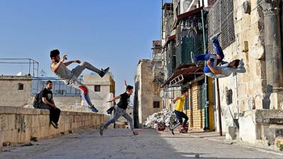 Boys practicing parkour