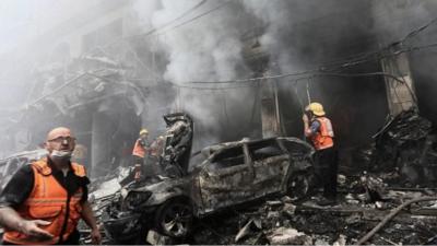 Rescue workers in Jabalia refugee camp