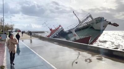 Ship being blown around in the sea.