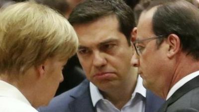 Greek Prime Minister Alexis Tsipras (C) talks with German Chancellor Angela Merkel (L) and French President Francois Hollande