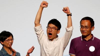 Nathan Law celebrates his win in Hong Kong's legislative council elections.