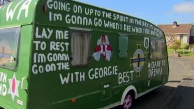 The NI football fans' caravan has been painted in the team's colours