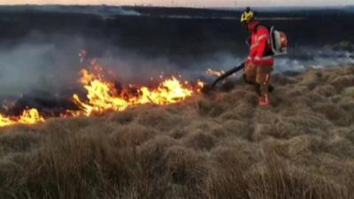 Fire fighter tackles moors fire