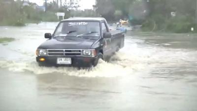 Car driving through flood water