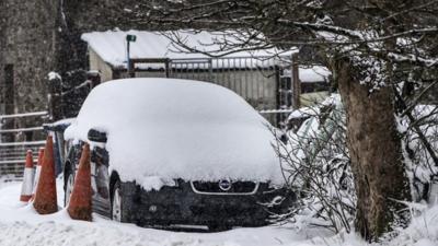 Car covered in snow near near Newby Head in North Yorkshire